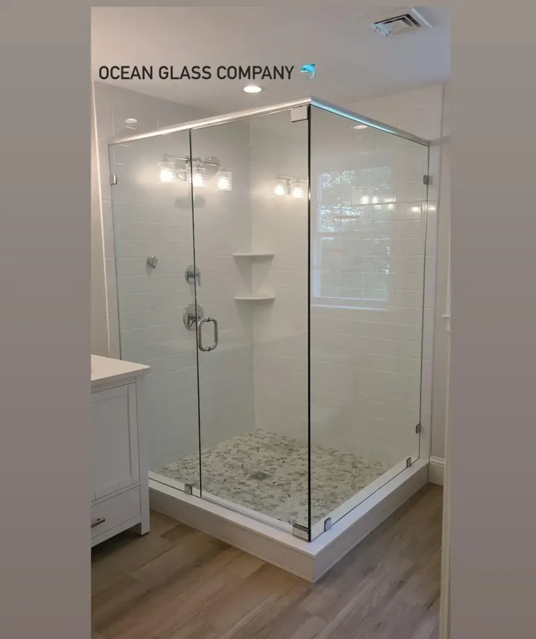Corner shower enclosure with a glass door