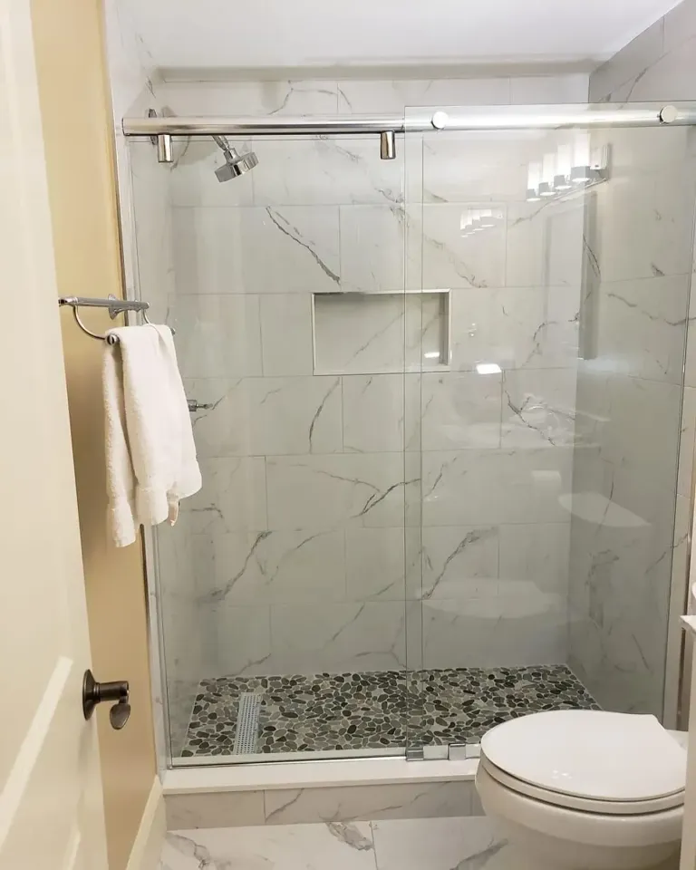 Frameless shower enclosure in a finished bathroom