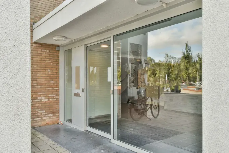 Commercial glass storefront and entrance in daylight