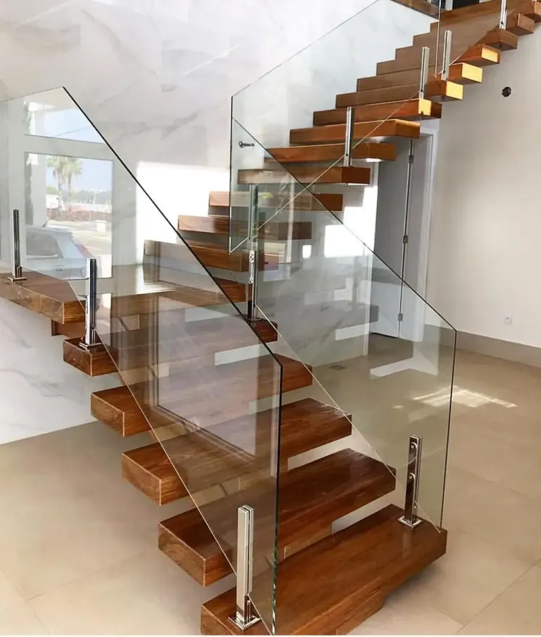 Glass railing beside a wooden staircase