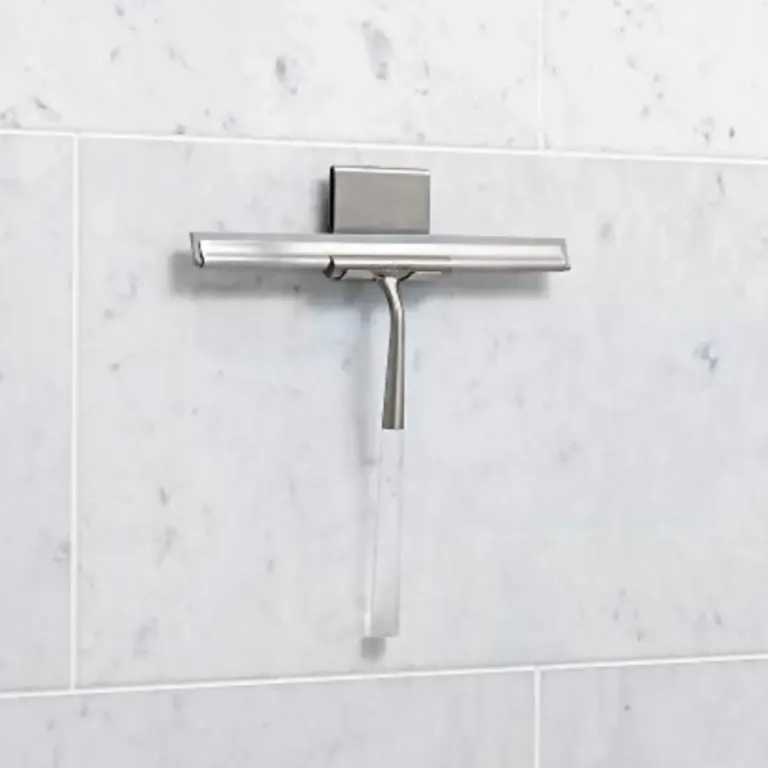 Shower squeegee on a tiled wall