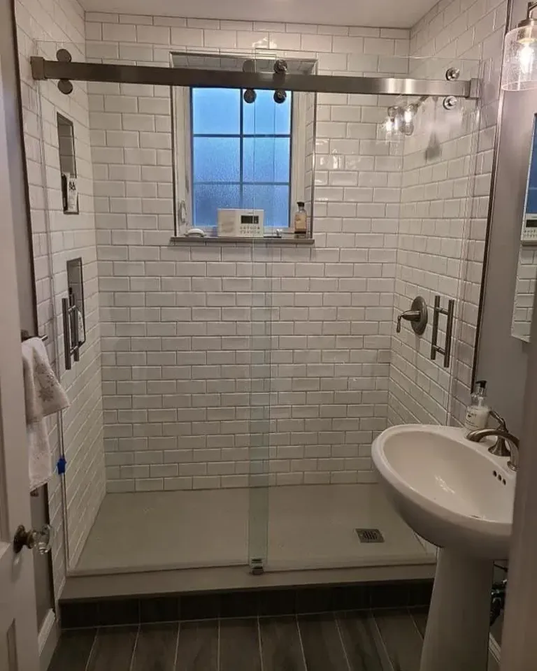 Sliding shower doors in a tiled bathroom