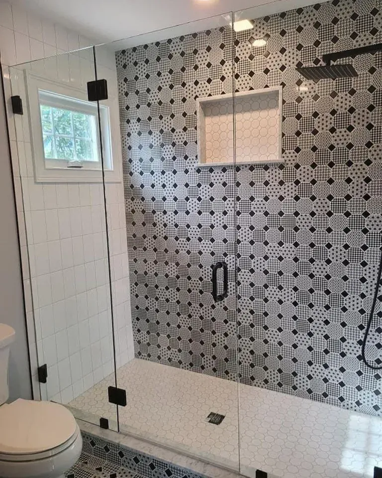 Shower glass beside patterned tile