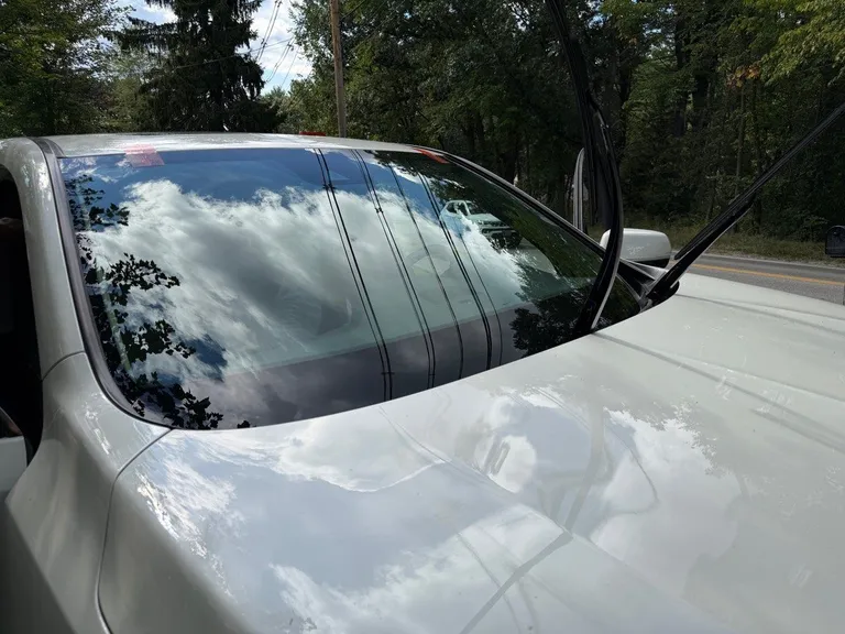 Completed windshield replacement on a 2017 Acura MDX in Wilmington Massachusetts with no tools resting on the vehicle