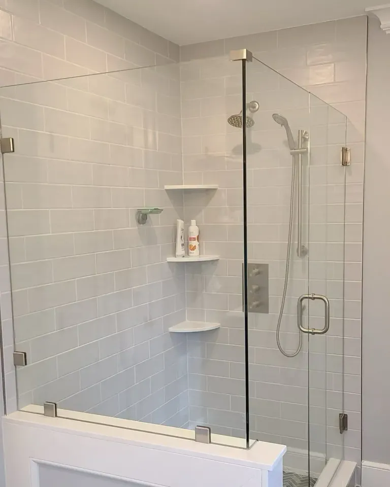 Hinged shower glass beside a half wall