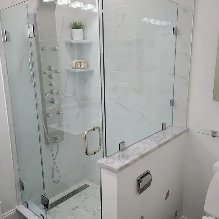 Shower glass above a tiled half wall