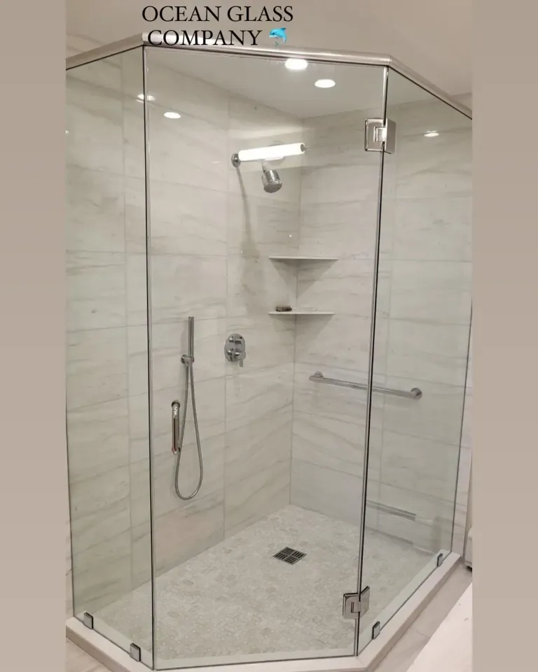 Corner shower glass with chrome fittings