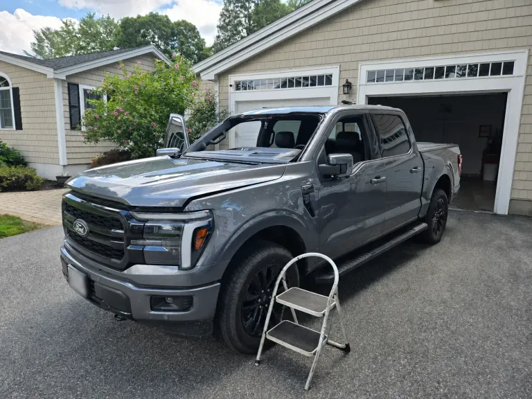 Ford pickup with windshield removed during auto glass replacement