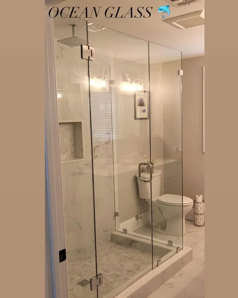 Corner glass shower enclosure