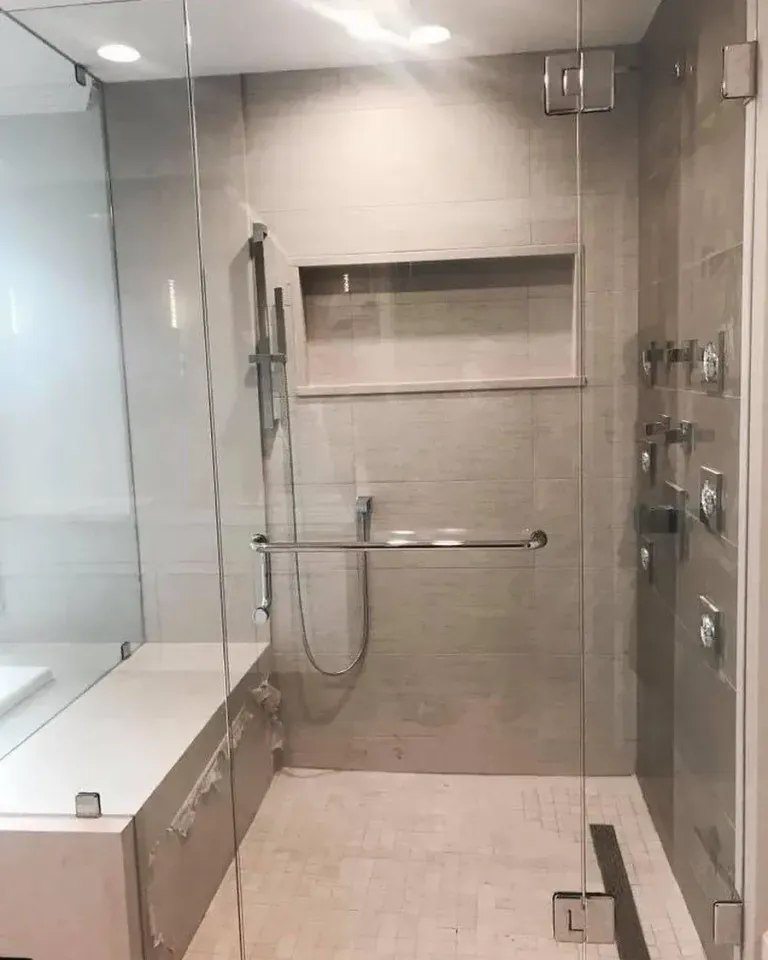 Shower glass beside a built-in bench