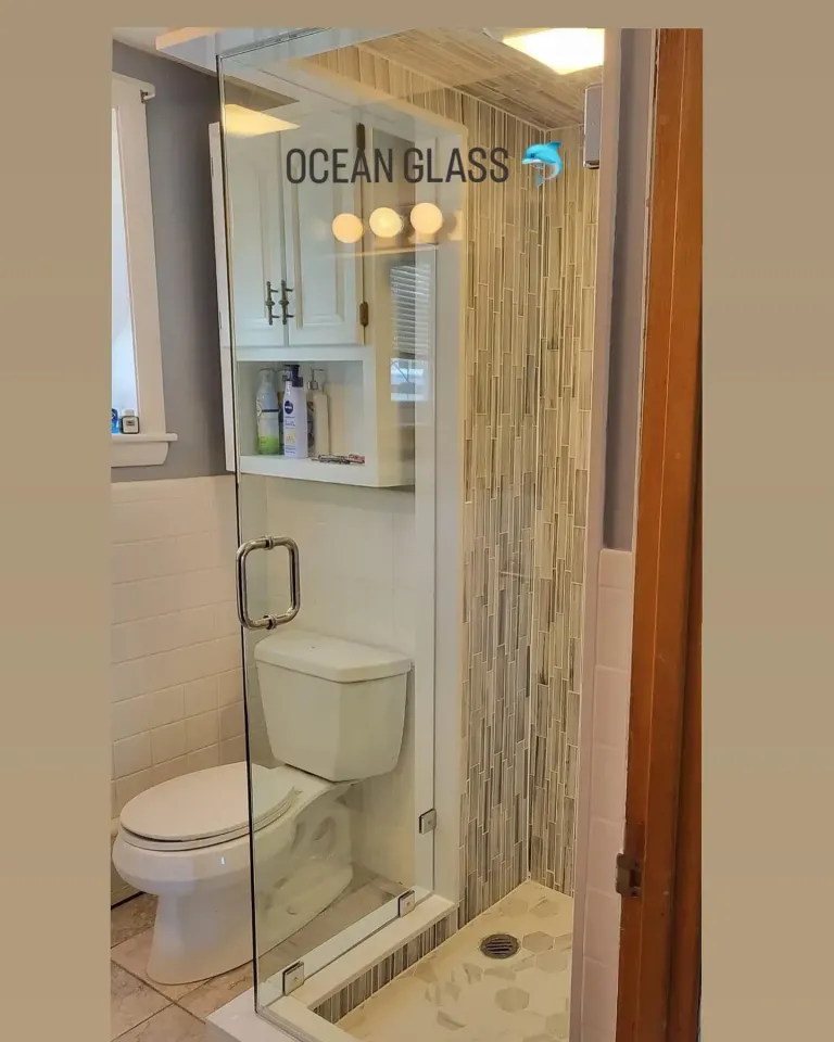 Clear shower door in a bathroom opening