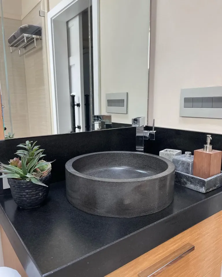 Bathroom vanity mirror above a vessel sink