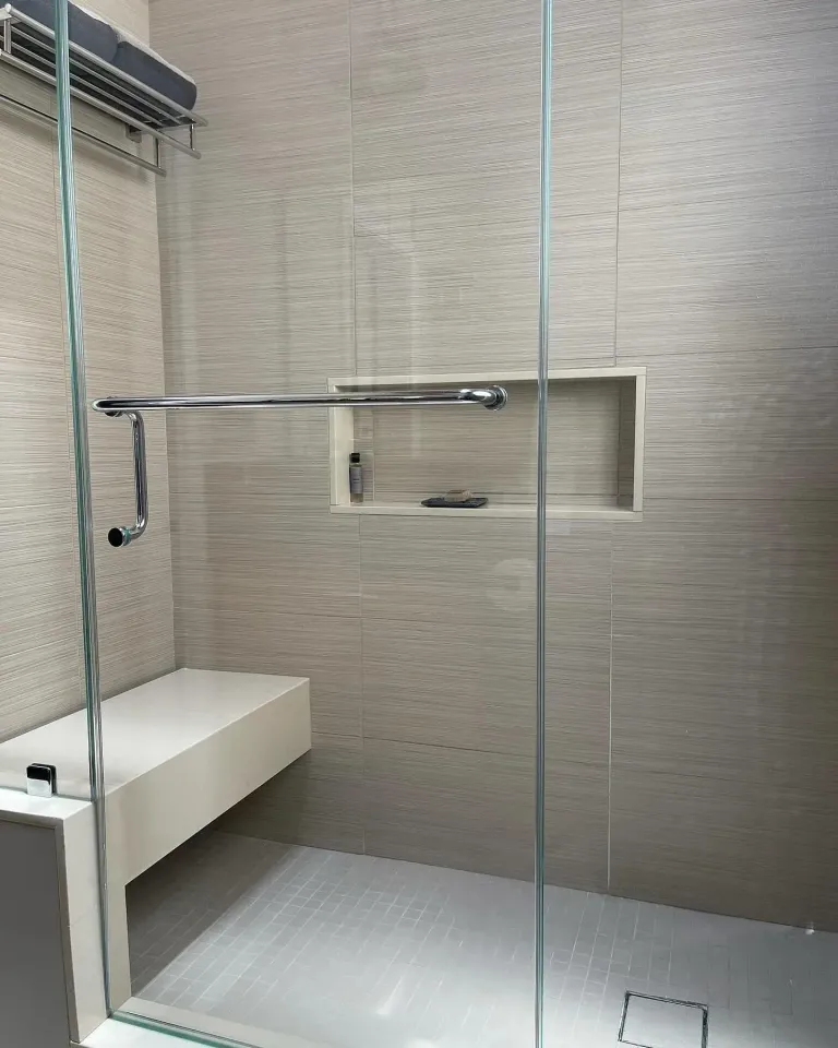 Shower glass beside a built-in seat