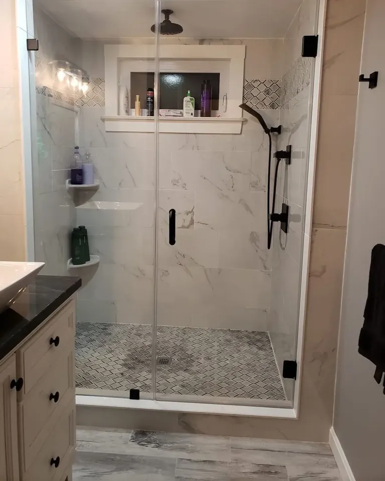 Glass shower enclosure in a bathroom
