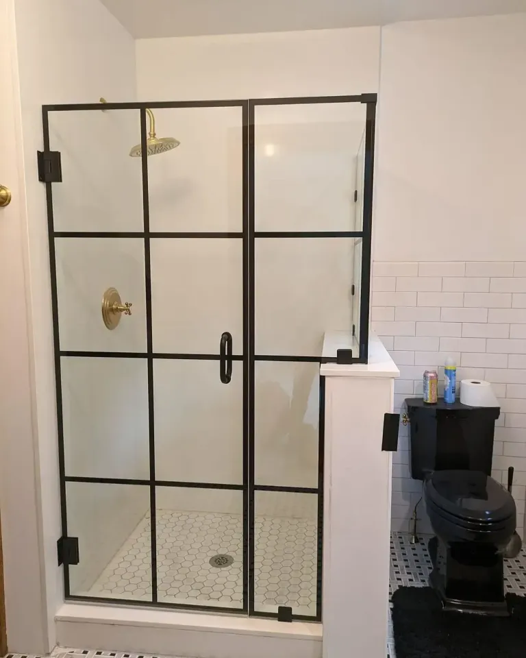 Grid-style shower door with dark trim